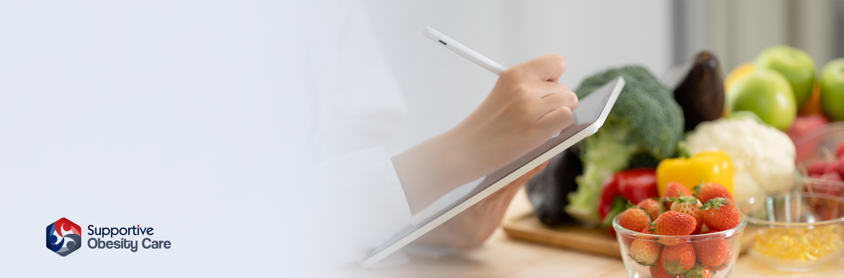 Dietitian writing notes on a tablet about various food options